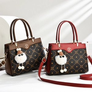 Classic brown and red handbags with vintage monogram patterns and plush keychain detail