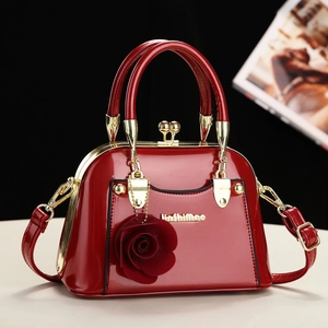 Elegant red patent leather handbag with gold hardware and rose charm for women