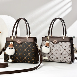 Detail of elegant crossbody bags in dark brown and beige with geometric patterns