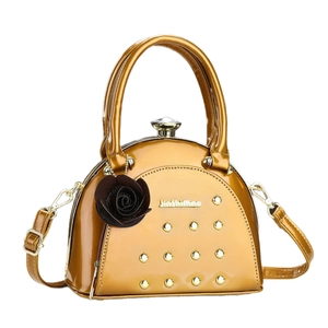 Golden patent leather handbag with gold rivets and flower pendant for women