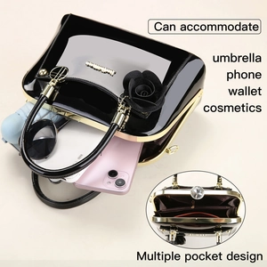 Detailed interior of black shell bag showing multi-pocket storage for essentials