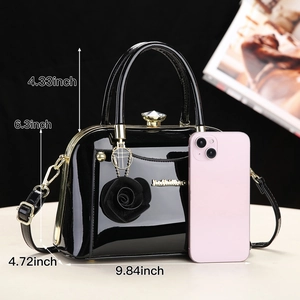 Detailed size guide of black patent leather handbag with 3D rose and diamond lock