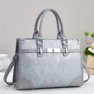 Retro light gray tote bag with textured finish, silver lock detail and adjustable strap