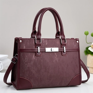 Retro burgundy faux leather handbag with vertical textures and silver metal turn-lock