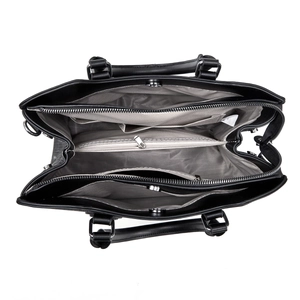 Top view of black leather handbag interior with dual compartments and silver zipper detail