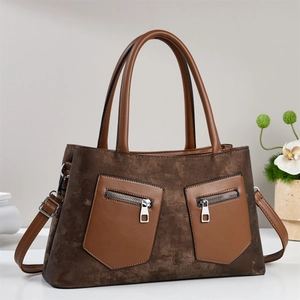 Vintage brown leather crossbody handbag with dual zip pockets and detachable strap