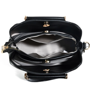 Vue intérieure du sac en cuir PU noir montrant trois compartiments et fermoirs magnétiques