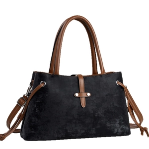 Vintage women's black suede handbag with brown leather straps and silver metal hardware