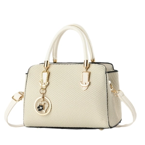 Elegant off-white woven texture handbag with gold hardware and floral heart pendant