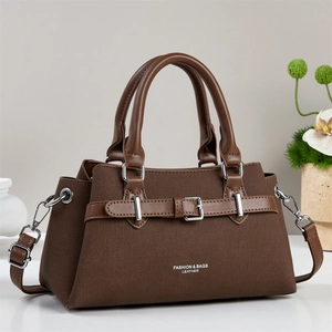 Large capacity canvas tote bag with brown leather straps and silver metal buckle