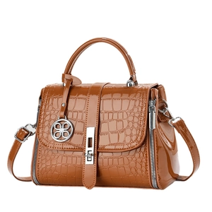 Brown crocodile embossed patent leather handbag with silver buckle and detachable strap