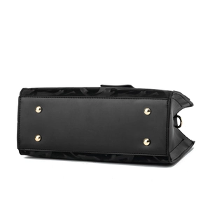 Close-up of black tote bag bottom with four gold protective metal feet and fine stitching