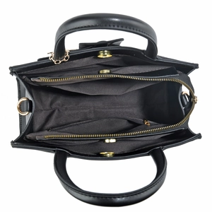 Top view of large black tote bag showing three interior compartments and golden hardware