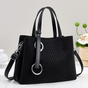 Fashionable black woven tote bag with silver ring hardware and detachable shoulder strap