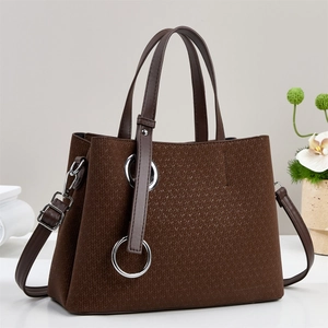 Brown tote bag with herringbone texture and silver ring, luxury shoulder bag style