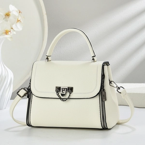 Elegant off-white lychee leather handbag with gunmetal hardware and orchid decor
