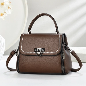 Deep brown pebbled leather satchel bag with white stitching and grey hardware details