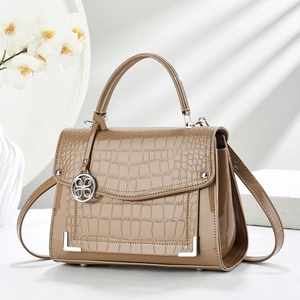Chic khaki embossed crossbody bag with glossy patent leather and floral charm detail