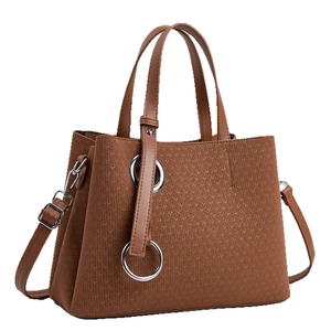 Brown woven texture tote bag with silver ring hardware and adjustable shoulder strap