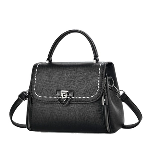 Fashionable black pebbled leather crossbody bag with silver studs and metal lock