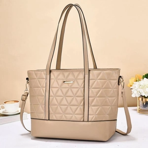 Minimalist beige tote bag with geometric triangle quilting and gold metal detail