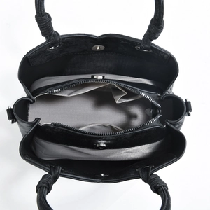 Top view of black tote bag showing organized interior compartments and herringbone lining