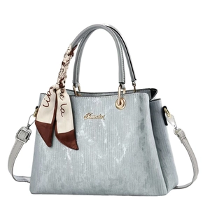 Elegant retro blue-grey tote bag with vertical textured finish and decorative silk scarf