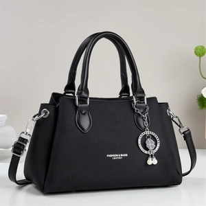 Retro black leather handbag for women with silver hardware and clover charm accessory