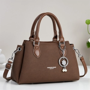 Brown woven texture handbag for women with silver charm and detachable shoulder strap