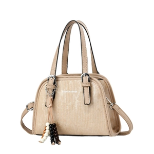 Beige bowling handbag with vertical stripes, fashion lettering, and beaded tassel