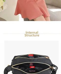 Detail view showing internal multi-compartment structure of black nylon crossbody bag