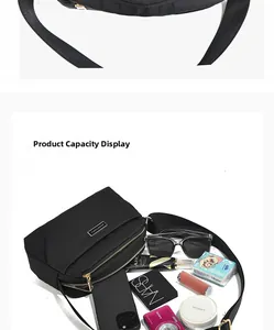 Internal capacity display of a black nylon crossbody bag showing storage for essentials