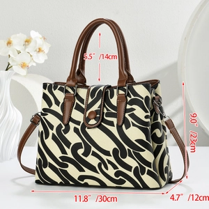 Chic geometric chain print canvas tote bag with brown leather handles and adjustable strap