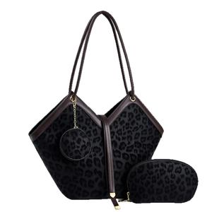 Three-piece black leopard print tote bag set with matching pouch and round charm bag