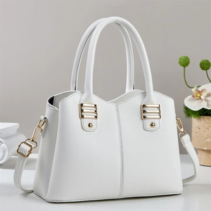 Elegant white litchi grain leather handbag with gold hardware and top handles