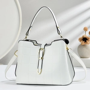 White structured tote bag with grid pattern texture and gold buckle on a light background