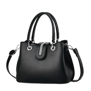 Elegant black leather handbag for women featuring silver rhinestone stripes and top handles