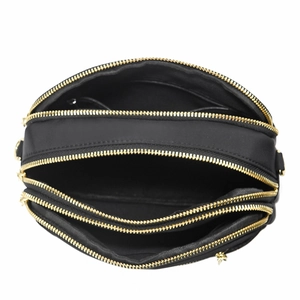 Detailed top view of a black nylon crossbody bag showing three zipper compartments and gold hardware