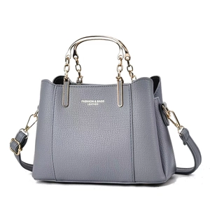 Elegant grey leather wedding handbag with gold metal handles and adjustable strap