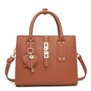 Brown lychee leather handbag with top handle, gold hardware and adjustable strap