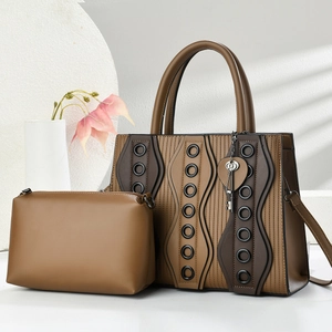 Two-piece minimalist tote bag set with heart charm and rivet textured leather detail