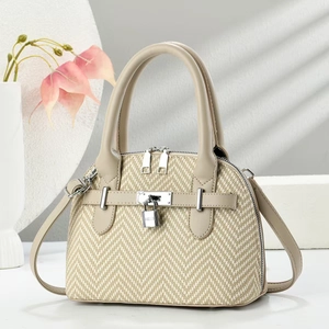 Elegant beige woven handbag with herringbone pattern and dual zipper closure