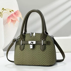 Elegant dark green herringbone fabric handbag with silver padlock and leather strap
