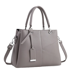 Elegant gray pebble leather handbag with geometric stitching and silver hardware