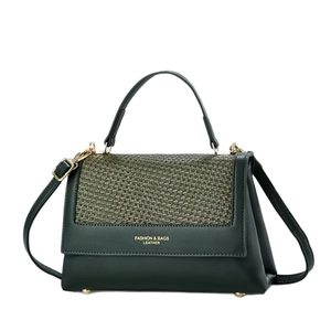 Classic dark green patchwork handbag with woven flap and adjustable crossbody strap