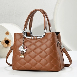 Elegant brown quilted leather handbag with silver handle and ocean charms for women