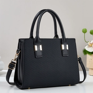 Elegant black large capacity handbag with textured leather and gold hardware