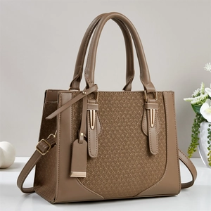 Coffee brown women's handbag with woven texture and adjustable shoulder strap