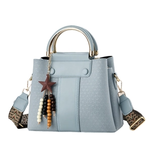 Structured Morandi blue crossbody bag with gold metal handle and ethnic strap