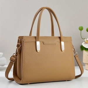 Retro brown lychee leather tote bag with gold leaf hardware and adjustable shoulder strap